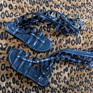 Black gladiator sandals.